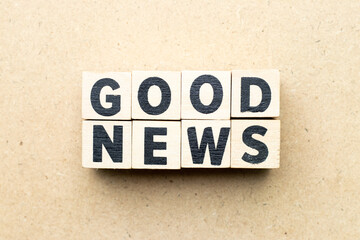Fototapeta premium Letter block in word good news on wood background
