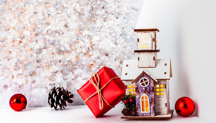 New Year's house with a gift. Christmas card with shadows