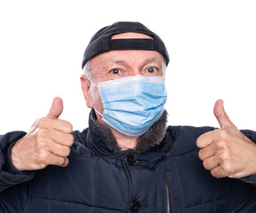 Health care concept. Senior man in protective mask  posing in studio over white background