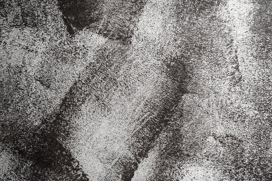 Abstract image of white paint on dark wall for background
