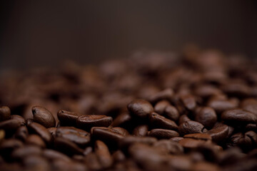 The hot of brown roasted coffee beans on brown background with copyspace, Healthy products by organic natural ingredients concept