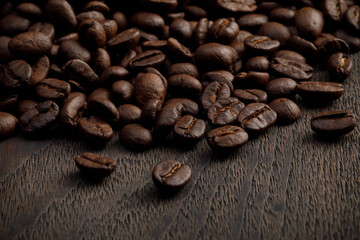 The hot of brown roasted coffee beans on brown background with copyspace, Healthy products by organic natural ingredients concept