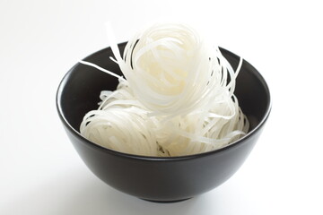 Vietnamese food, dried rice noodles in bowl with copy space