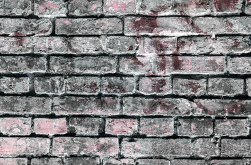 Old, weathered brickwork with crumbling plaster. Background. Vintage.