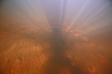 Naklejka premium rays of light under water, abstract marine background nature landscape rays blurred