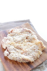 breadcrumbs and pork for Milano cutlet prepared for cooking