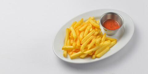 A serving of french fries with tomato sauce. Fast food, junk food concept.