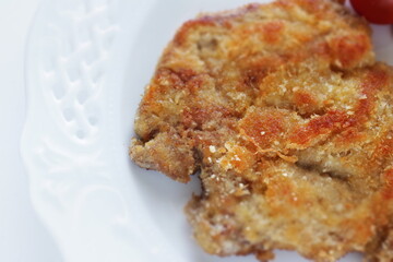 Homemade Milino cutlet on dish with copy space