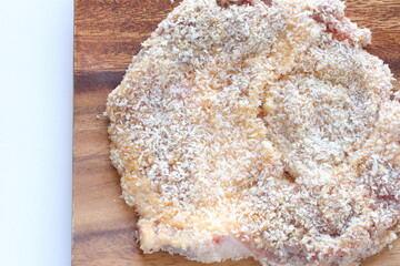 breadcrumbs and pork for Milano cutlet prepared for cooking