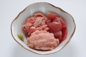 Assorted tuna fish and spice Wasabi in bowl with copy space