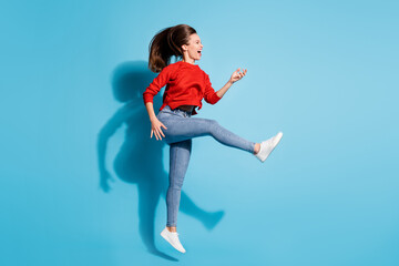 Full size photo of funky crazy lady jump flight play imaginary guitar musician isolated blue color background