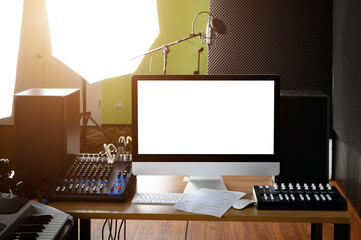 Computer desk used to control the sound in the recording room Equipped with microphone and music equipment.