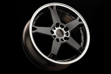 sporty light black alloy wheel with a white matte rim, close-up