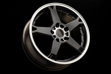 Obraz premium sporty light black alloy wheel with a white matte rim, close-up