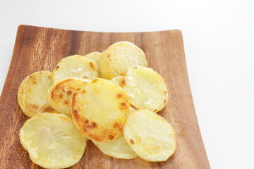 homemade fried potato on wooden plate with copy space