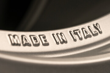 made in Italy- lettering on the rim of the new alloy wheel. Italian industry and production