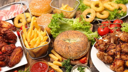 assorted of american food- hamburger, french fries, nugget and fried onion rings