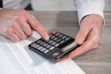 Male hands making calculation