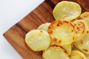 Naklejka na ściany i meble homemade fried potato on wooden plate with copy space