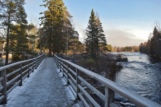 Snowy and icy winter wooden trail in the forest near Koitelinkoski in Finland, Oulu