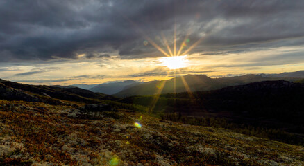 Cairn outdoors in nature during golden hour and sunset. Panoramic view. Travelling and landscapes concept.