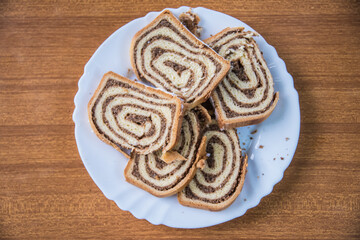 Homemade strudels on a wooden table in the countryside