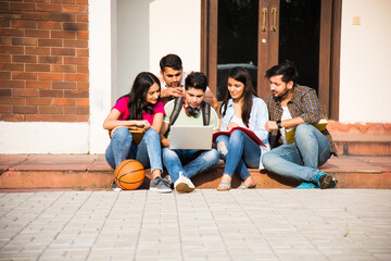 Asian Indian college students doing group study or working on project