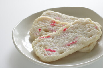 Japanese food, red ginger in fish cake on white dish