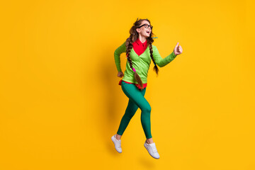 Full length body size view of attractive funky cheerful girl jumping running 1 September isolated bright yellow color background