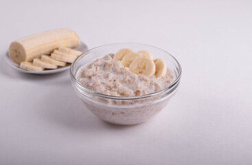 natural vegan oat granola cooked porridge and banana