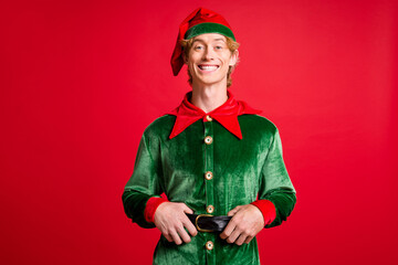 Photo of funky elf guy touch his black belt happy christmas x-mas newyear event concept isolated on...