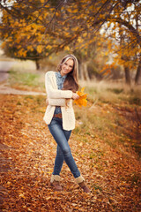 young girl in autumn park