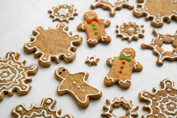 Christmas ginger cookies, snowflake shape, icing decore. To pview. Abstract Christmas food.