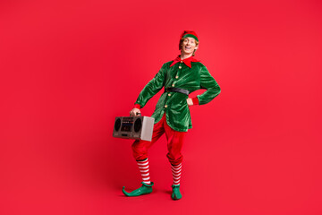 Full length photo of funky elf guy hold boom box wear x-mas christmas festive costume isolated on bright shine color background