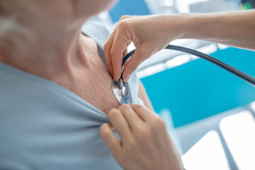 Close up picture of doctors hand with stethoscope
