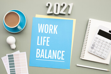 2021 work life balance concepts with text on desk.
