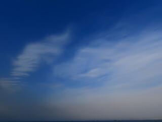 Naklejka na ściany i meble Beautiful blue sky and white clouds over the mediterranean sea in autumn in Israel.
