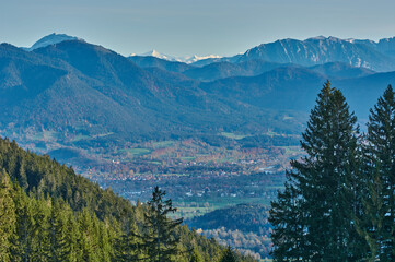 Panoramic mountain landscape in the German alps. Snowy mountain peaks in the alps. View on a valley and snowy mountain peaks in the background.