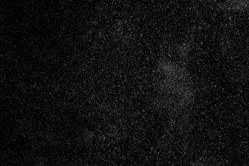 abstract real dust floating over black background for overlay