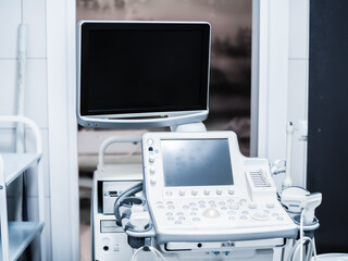 Ultrasound machine with buttons, sensors and monitors. Modern medical equipment in white gray colors