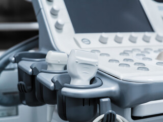 Ultrasound machine with buttons, sensors and monitor. Modern medical equipment in white gray. Details. Close-up