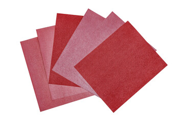The stack of the brown sandpaper sheets different grit sizes isolated on the white background