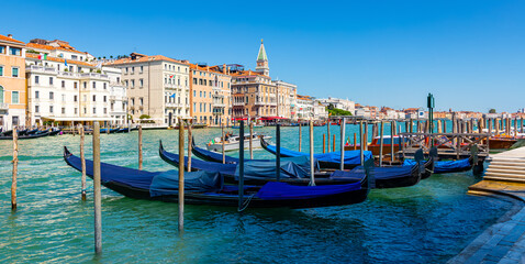 Fototapeta premium Picturesque view of Venice Grand Canal with gondolas and old buildings on banks of canal