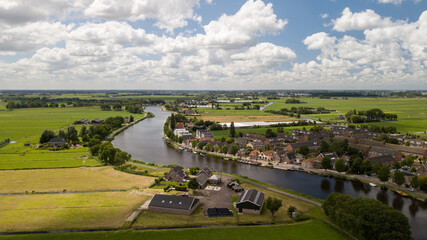 Fototapeta na wymiar River and village Nieuwekerk aan de Amstel in the Netherlands