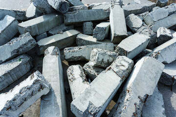 Dismantling of dilapidated concrete structures. Building materials after prolonged use. Close-up