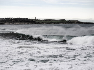 Spray surfing tube waves in the north coast of Spain, Santander