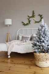  Christmas tree in a wicker basket on a wooden floor in a luxury apartment. Hello Winter, December, January and February. Hugge-style Christmas Decorated Apartments