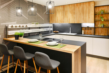 Modern fitted kitchen interior with bar counter