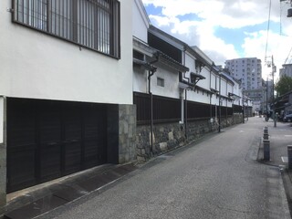 Fototapeta na wymiar A street with white-walled storehouses