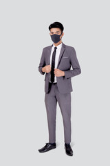 Obraz premium Portrait young asian businessman in suit confident wearing face mask for protective covid-19 isolated on white background, business man medical mask, quarantine for pandemic coronavirus.